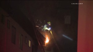 Torrance firefighters worked to extinguish a blaze at an apartment building on Aug. 23, 2015. (Credit: Loudlabs)