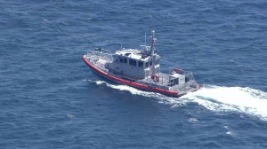 A U.S. Coast Guard response boat searches for a missing fisherman off Dana Point on Aug. 4, 2015. (Credit: KTLA)