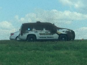 Carl Zink of the Garvin County Sheriff’s Office posted this photo of bees swarming an SUV after a big-rig carrying honey bees overturned on Sept. 29, 2015.