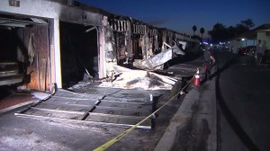 Several burned garages are pictured after a fire in Anaheim that broke out on Sept. 25, 2015. (Credit: KTLA)