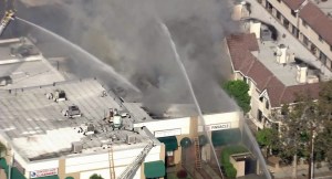 A strip mall caught fire in Monterey Park Wednesday morning. (Credit: KTLA) 