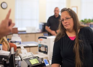 Kim Davis, the Rowan County Clerk of Courts, listens to Robbie Blankenship and Jesse Cruz as they speak with her about getting a marriage license at the County Clerks Office on Sept. 2, 2015, in Morehead, Kentucky. Citing a sincere religious objection, Davis, an Apostolic Christian, has refused to issue marriage licenses to same-sex couples in defiance of a Supreme Court ruling. (Credit: Ty Wright/Getty Images)