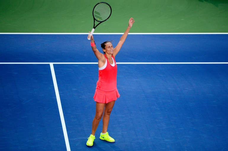 Roberta Vinci of Italy celebrates after defeating Serena Williams on Day 12 of the 2015 U.S. Open in Queens, New York. (Credit: Alex Goodlett/Getty Images)