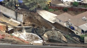 A home in San Gabriel was in danger of collapse due when stormwater undermined a rail project nearby on Sept. 14, 2015. (Credit: KTLA)