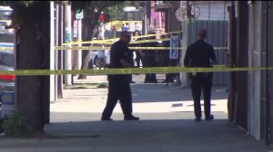 An investigation was underway after police fatally shot an allegedly armed woman in South Los Angeles on Sunday, Sept. 27, 2015. (Credit: KTLA)