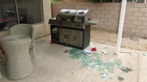 Shattered glass is seen in the backyard where a homeowner struggled with an intruder in Santa Ana. (Credit: KTLA)