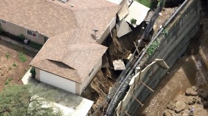 A home appears to be in danger of sliding down a hillside in San Gabriel on Sept. 15, 2015. (Credit: KTLA)