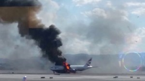 A fire broke out Tuesday on an outbound British Airways flight at Las Vegas' airport, leading two people to be transported for medical care for what the airport called "minor injuries."(Credit: @ericmhays)