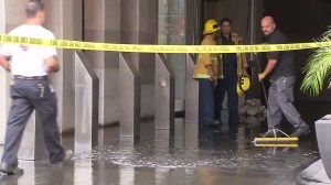 Cleanup continued after a pipe broke on the 25th floor of a building in downtown L.A. on Sept. 21, 2015. (Credit: KTLA)