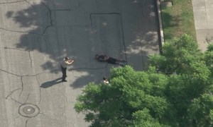 A man who was punched by at least one deputy appeared to have his hands behind his back as deputies approached on Oct. 15, 2015, in Pasadena. (Credit: KTLA)