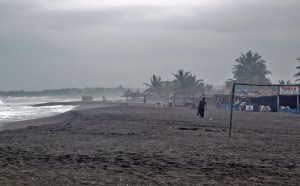 A man walks at the beach in Boca de Pascuales, Colima State, Mexico, on Oct. 22, 2015. Fast-moving Patricia grew into an "extremely dangerous" major hurricane off Mexico's Pacific coast on Thursday, forecasters said, warning of possible landslides and flash flooding. (Credit: HECTOR GUERRERO/AFP/Getty Images)