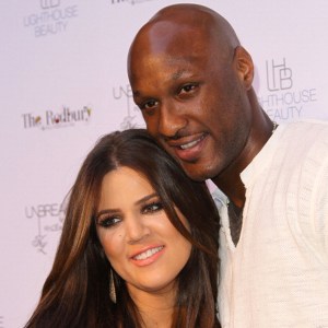 Khloe Kardashian and Lamar Odom pose for photographers during the 'Unbreakable' Fragrance Launch at The Redbury, Los Angeles on April 4, 2011. (Credit: Frederick M. Brown/Getty Images)