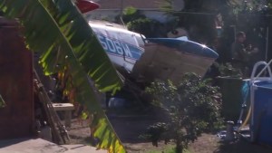 The wreckage of a small plane crash sat in a Compton yard on Oct. 7, 2015. (Credit: KTLA)