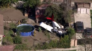 Firefighters responded to a plane crash near Compton/Woodley Airport on Oct. 7, 2015. (Credit: KTLA)