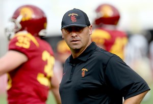 Head coach Steve Sarkisian of the USC Trojans watches his team during warmups for the game with the Idaho Vandals at Los Angeles Memorial Coliseum on September 12, 2015 in Los Angeles, California. (Credit: Stephen Dunn/Getty Images)