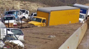 Cars and trucks were stuck in several feet of mud on Highway 58 on Oct. 16, 2015. (Credit: KTLA)