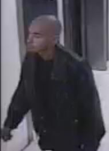 A surveillance video screenshot shows a man wanted in connection with an armed robbery at a Macy's in Redondo Beach on Thursday, Nov. 19, 2015. (Credit: Redondo Beach Police Department)