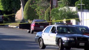 Homicide investigators respond after a body is found inside a vehicle in unincorporated West Whittier-Los Nietos on Nov. 29, 2015. (Credit: RMG News)