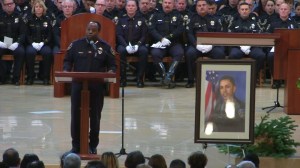 Downey Police Department Chief Carl Charles speaks about Officer Ricky Galvez at his funeral on Nov. 30, 2015. (Credit: pool)