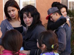 Aracelia Sandoval, center, is flanked by family members on Feb. 5, 2014, while grieving for her 19-year-old son Jerry Arredondo Jr., who was killed in a hit-and-run incident in South Los Angeles. (Credit: Irfan Khan / Los Angeles Times)