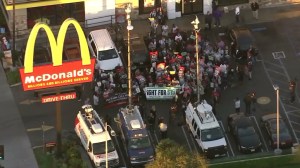 Workers in the Los Angeles area are pictured joining the nationwide Fight for $15 protest on Nov. 10, 2015. (Credit: KTLA)