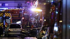 Police are seen outside a cafe in 10th arrondissement of the French capital Paris, on November 13, 2015. (Credit KENZO TRIBOUILLARD/AFP/Getty Images