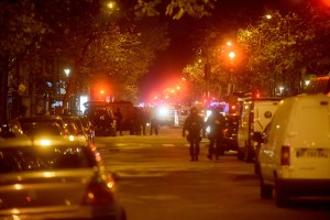 Policemen patrol the streets during gunfire near the Bataclan concert hall on November 13, 2015 in Paris, France. (Credit: Antoine Antoniol/Getty Images)