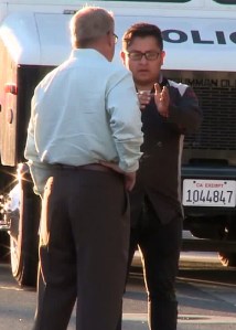 Cesar Guzman is seen talking to police after a fatal hit-and-run -crash in Santa Ana. (Credit: KTLA)