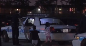 Several children are seen being led away from a Houston home after a 19-month-old died on Nov. 17, 2015. (Credit: KNOE)