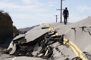 A skater walks along Vasquez Canyon Road, which was shut down on Nov. 19, 2015. (Credit: Gantry Hill)