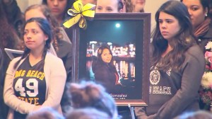 Fellow Cal State Long Beach students were among those who gathered for a vigil honoring Nohemi Gonzalez on Sunday, Nov. 15, 2015. (Credit: KTLA)