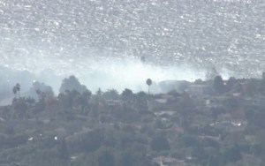 Smoke rises from a small fire in Pacific Palisades on Nov. 10, 2015. (Credit: KTLA)