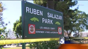Crime-scene tape is seen at Ruben F. Salazar park after a fatal double-shooting on Nov. 22, 2015. (Credit: KTLA)