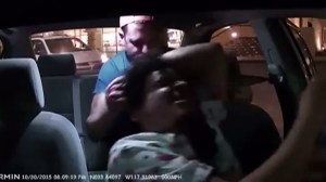 A screenshot from a video allegedly shows a violent attack on an Uber driver by a passenger in Costa Mesa on Friday, Oct. 30, 2015. (Credit: Edward Caban/YouTube)