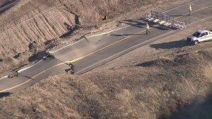 Sky5 aerials show a buckling Vasquez Canyon Road in Canyon County. (Credit: KTLA)