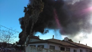 Smoke rose above Harbor Gateway as a massive fire burned at a recycling yard on Dec. 12, 2015. (Credit: Antonio De Jesus Osuna)