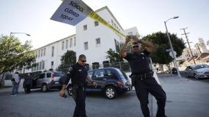 Los Angeles School Police Officers Frank Avelar, left, and Jose Zamora leave Breed Street Elementary after conducting a safety check on Dec. 15, 2015. (Credit: Irfan Khan / Los Angeles Times)