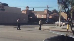 A screenshot from a witness's video appears to show Los Angeles County sheriff's deputies fatally shooting a man near a gas station in Lynwood on Dec. 12, 2015.