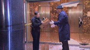 Police investigators are seen outside the Standard Hotel in downtown L.A., where four people were shot on Dec. 13, 2015. (Credit: KTLA)
