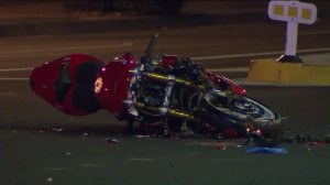A motorcycle is seen at the site of a fatal crash in Gardena on Dec. 17, 2015. (Credit: KTLA)
