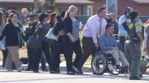 People are escorted away from the scene of a shooting in San Bernardino on Dec. 2, 2015. (Credit: KTLA)