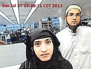 Tashfeen Malik and Syed Rizwan Farook were photographed at O'Hare Airport in July 2014. (Credit: Chicago O'Hare Airport via CNN Wire)