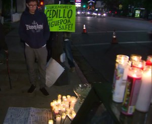 A young man stands at a vigil for Andres Perez on Dec. 15, 2015. (Credit: KTLA)