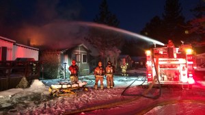 Three children and a woman were killed, and a man was hospitalized, when a fire burned through a mobile home in Big Bear Lake on Dec. 25, 2015. (Credit: Travis Byrne) 