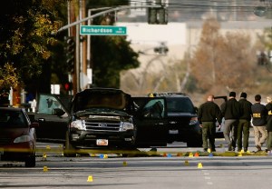 FBI agents and local law enforcement examine the crime scene where suspects in the Inland Regional Center were killed on Dec. 3, 2015, in San Bernardino. (Credit: Sean M. Haffey/Getty Images)