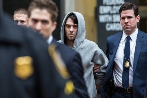 Martin Shkreli, center, CEO of Turing Pharmaceutical, is brought out of 26 Federal Plaza by law enforcement officials after being arrested for securities fraud on Dec. 17, 2015, in New York City. Shkreli gained notoriety earlier this year for raising the price of Daraprim, a medicine used to treat the parasitic condition of toxoplasmosis, from $13.50 to $750, though the arrest does not involve that price hike. (Credit: Andrew Burton/Getty Images)