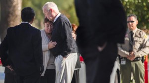 Family members console each other at the funeral for Damian Meins, who was killed in the San Bernardino shooting rampage, at St. Catherine of Alexandria Church in Riverside. (Credit: Gina Ferazzi/Los Angeles Times)