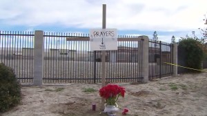 A small memorial was placed outside the Inland Regional Center on Dec. 3, 2015, a day after a mass shooting claimed the lives of 14 people. (Credit: KTLA)