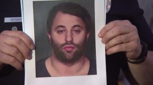Jack Perry is shown in a photo held by an LAPD captain on Dec. 28, 2015. (Credit: KTLA)