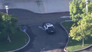 An LAPD car is seen outside Ramon C. Cortines School in Los Angeles among a district-wide closure of campuses on Dec. 15, 2015. (Credit: KTLA)